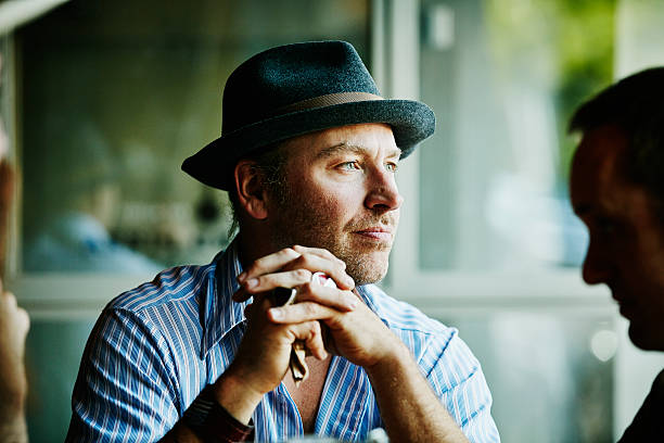 The wise man sitting in a restaurant with his friends