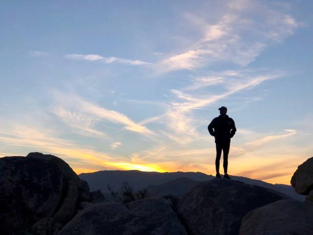 Image23 A silhouette of person standing on the crest